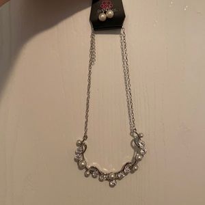 A necklace and earrings brand new